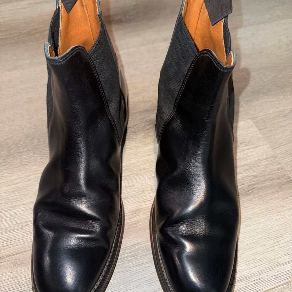 This product is a stylish pair of British-made black leather Chelsea ankle boots